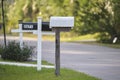 Typical american outdoors mail box on suburban street side Royalty Free Stock Photo