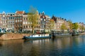 Typical Amsterdam houses along the canal, living boats in springtime, Holland Netherlands Europe Royalty Free Stock Photo