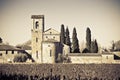 Typical ancient italian Romanesque church immersed in the Tuscany countryside near a Cemetery - Italy - Toned Image Royalty Free Stock Photo