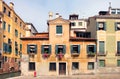 Typical ancient medieval venetian house with orange plaster wall