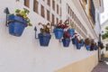 Typical Andalusian street adorned with pots and flowers in Estepona, Costa del Sol, Spain Royalty Free Stock Photo