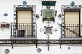 Typical andalusian white village house window and flower decoracion Royalty Free Stock Photo