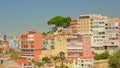 Typical apartment building in pastel colors on a hill with viewpoint in Lisbon, Portugal