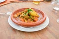 Typical Arabic tagine food on a brown ceramic bowl