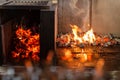 Typical Argentinian barbecue or asado. Burning wood in the grill and red hot coals Royalty Free Stock Photo