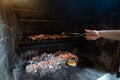 Typical Argentinian barbecue or asado. hand Royalty Free Stock Photo