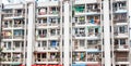 Typical Asian apartment block comprising series rooms with exterior balconies all with laundry hanging out to dry