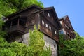 Typical Austrian Alpine houses with bright flowers, Hallstatt, Austria, Europe Royalty Free Stock Photo