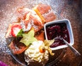 Typical austrian or german pancake dessert with berries and whip