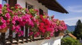 typical austrian house, beautiful balconies with typical blooming pelargoniums. Blooming flowers on an Austrian house in Tyrol