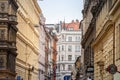 Typical Austro-Hungarian Facades of baroque apartment residential buildings in a street of old town, historical center of Prague