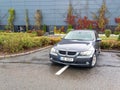 Typical bad and wrong parking of BMW car drivers through two parking spaces Royalty Free Stock Photo