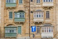 Typical balconies in the streets of Valetta, Malta Royalty Free Stock Photo