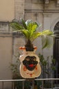 Typical balcony flower pots in form of a female head in Sicilia, Italy Royalty Free Stock Photo