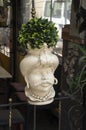 Typical balcony flower pots in the form of a man head in Sicilia, Italy Royalty Free Stock Photo