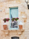 Typical balcony in a stone house of southern Italy. Royalty Free Stock Photo