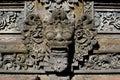 Typical Balinese Barong mask carved in stone Royalty Free Stock Photo