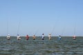 Typical Balinese fishermen standing in a row Royalty Free Stock Photo