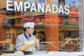 Buenos Aires, Argentina - Argentinian typical bar with empanadas, cook preparing food seen through the window