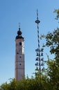 Typical Bavarian church tower and a traditional maibaum, maypole Royalty Free Stock Photo
