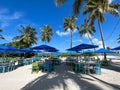 A typical beach restaurant with colorful tables, chairs and umbrellas in the Florida Keys Royalty Free Stock Photo
