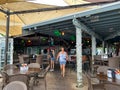 A typical beach restaurant named Robbies with colorful tables, chairs and umbrellas in the Florida Keys Royalty Free Stock Photo