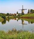 Typical beautiful idyllic dutch countryside landscape, small rural village with old windmill, lake and green meadow - Terheijden