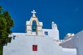 Typical bell tower or small belfry of a whitewashed Greek Orthodox church on a clear summer day. Greek island. Blue sky Royalty Free Stock Photo