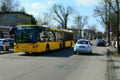 Typical Berlin bus on a rural shopping street photographed with a filter that makes the scene look like a miniature