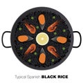 Typical black Spanish rice. Traditional paella made with rice an Royalty Free Stock Photo