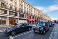 Typical black taxis at the famous Regent Street in London