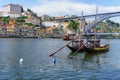 Typical boats of the Douro River in Oporto. Panoramic views of the historic city center of Porto in Portugal.