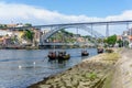 Typical boats of the Douro River in Oporto. Panoramic views of the historic city center of Porto in Portugal. Royalty Free Stock Photo