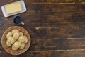 Typical brazilian cheese buns in a basket, butter and coffee with copu space Royalty Free Stock Photo