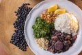Typical Brazilian dish called Feijoada. Made with black beans, pork and sausage Royalty Free Stock Photo