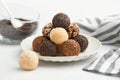 Typical Brazilian sweet brigadeiro. A heap of assorted flavors of candies on a white table Royalty Free Stock Photo