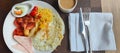 Typical breakfast at a hotel in Vietnam. Coffee, sausages, pastrami, bacon Royalty Free Stock Photo