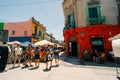 Typical brightly colored building on Caminito in La Boca witn tourists, Buenos Aires, Argentina - dec 2th 2023 Royalty Free Stock Photo