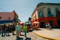 Typical brightly colored building on Caminito in La Boca witn tourists, Buenos Aires, Argentina - dec 2th 2023 Royalty Free Stock Photo