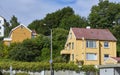 Kristiansund, Norway - 24th July 2011:Typical brightly coloured wooden clad Norwegian Houses built on to a steep hill. Royalty Free Stock Photo