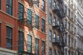 Typical building facades with fire escape stairs, New York Royalty Free Stock Photo