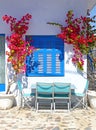 Bougainvillea around a window in Santorini Royalty Free Stock Photo