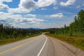 Typical Canada: Beautiful canadian landscape - Road leads through beautiful forest on a sunny day