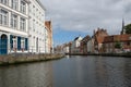 Typical canal scene in Brugge / Brugge, Belgium showing medieval buildings overlooking the water