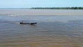 Typical canoe travelling along the Amazon River in the Amazonia Rain Forest South America Royalty Free Stock Photo