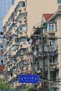 Linens drying at windows in in fast growing Shanghai