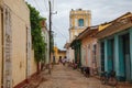 Typical cobblestone street, Palacio Cantero tower and the colonial buildings in Trinidad, Cuba