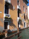 Typical colored facade of house in Venice waterway