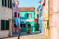 Typical colorful house of Burano Island with hanging laundry at its facade Royalty Free Stock Photo