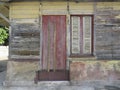 Rusty wooden colorful house in Martinique, French West Indies. Tropical multicolor windows Royalty Free Stock Photo